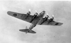 Japanese captured B-17D in the air on its way to the home islands. Picture taken from the ground looking up as it passes overhead.
