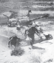Pakistani soldiers disembark from M4A1E6 Sherman (1965 War).jpeg