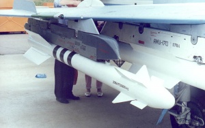Close-up image of an R-73 missile mounted on the outer pylon (Station 4) of a upgraded MiG-21 prototype desmonstrator, on static ground display during the 1999 MAKS airshow. There is a R-77 visible on the inner pylon (Station 3)