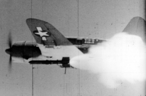 An SB2-C Helldiver firing a Tiny Tim rocket